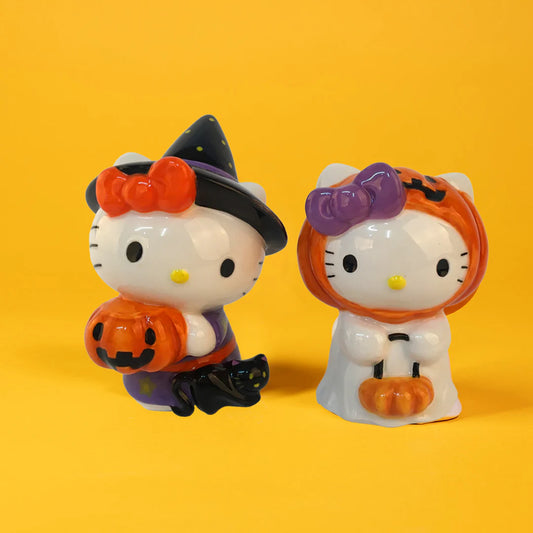 Two Halloween-themed Hello Kitty salt and pepper set. Witch and pumpkin ghost